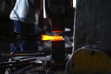 hot metal beating machine in workshop, 