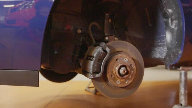 Car suspension and brake disk