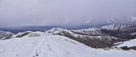 Little Black Mountain Peak hiking trail snow views winter via Bonneville Shoreline Trail, Wasatch Front Rocky Mountains, by Salt Lake City, Utah. United States.