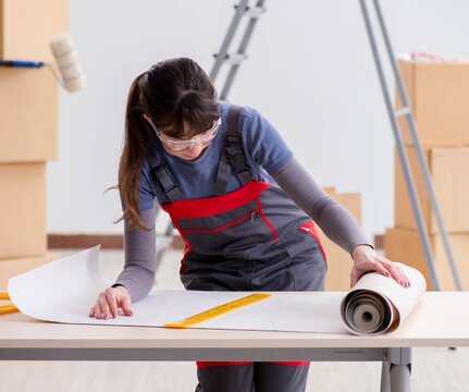 Woman preparing for wallpaper work