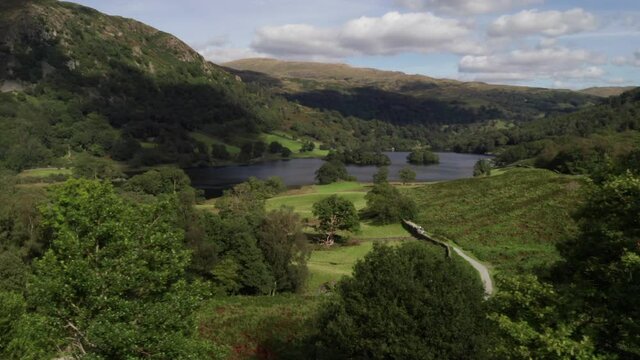 Drone shot panning across a scenic view of Rydal in English The Lake District. Stock footage video clip