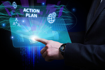 Business, Technology, Internet and network concept. Young businessman working on a virtual screen of the future and sees the inscription: Action plan