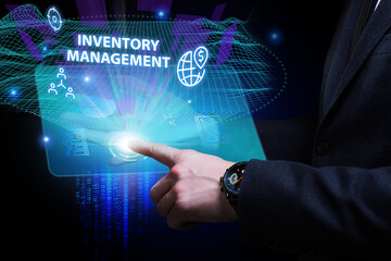 Business, Technology, Internet and network concept. Young businessman working on a virtual screen of the future and sees the inscription: Inventory management