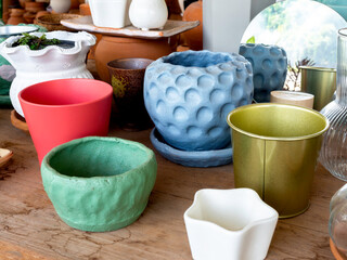 Various colorful plant pots in the shop.