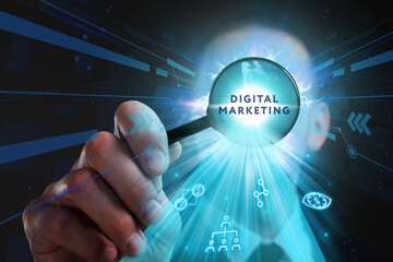 Business, Technology, Internet and network concept. Young businessman working on a virtual screen of the future and sees the inscription: Digital marketing