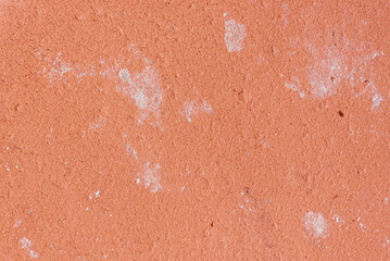 The texture of terracotta ceramics with cracks and efflorescence. Close-up.