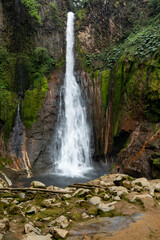 Bajos del Toro Waterfall, person standing bellow a tall waterfall, Costa Rica