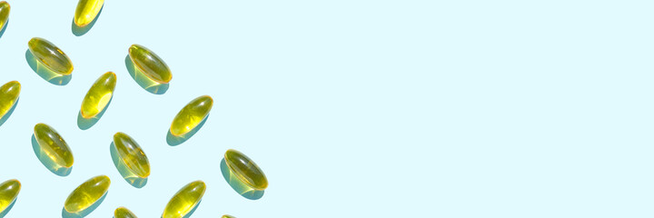 Omega3 gel capsule. Sun shadow. Yellow vitamin. Health eating. Dietology drug. Fish oil supplement. Nutritional concept. Golden softgel collagen. Medicine immunity cosmetics