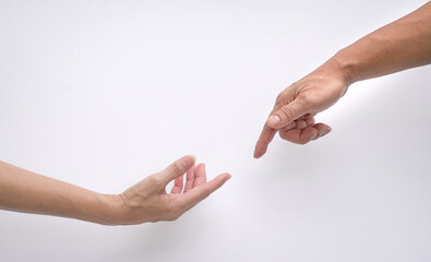 Male and female hands reaching out to each other, creation of adam sign. Isolated.