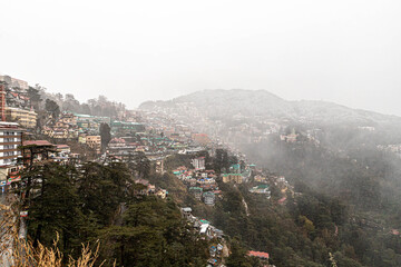 Fototapeta premium beautiful view of shimla city and mall road after snowfall.