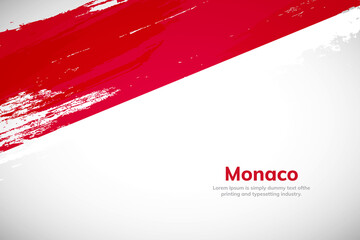 Brush painted grunge flag of Monaco country. Hand drawn flag style of Monaco. Creative brush stroke concept background