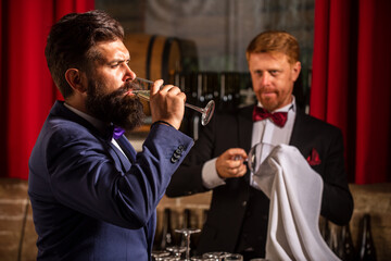 Bartender at counter. Alcohol serving. Communication with customers.