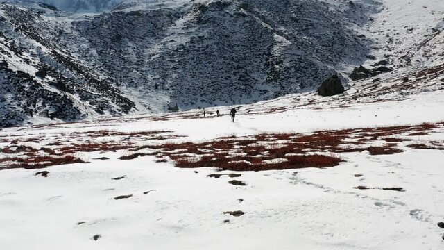 Group of men on the way towards Nanga Parbat's basecamp in Pakistan. aerial