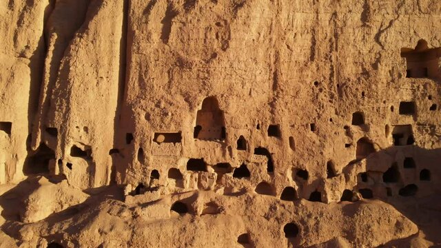 Ancient Buddhist Caves In Bamyan Afghanistan - aerial sideways