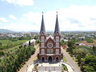 Fototapeta na wymiar Aerial view of Church of the Holy Mother (another name is Thanh Mau church) in Bao Loc Town, Lam Dong, Vietnam.