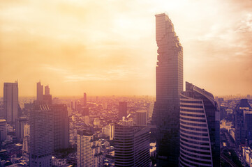 Aerial view of Bangkok city at twilight sunset in Thailand. cityscape of Modern buildings and urban architecture