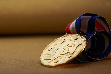 label 1st on the golden medal with blue and red ribbon