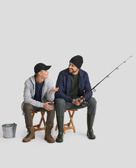 Happy father and son fishing on white background