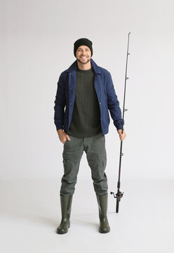 Man With Fishing Rod On White Background