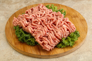 Raw pork minced meat over board