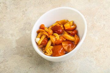 Marinated pickled honey mushrooms in the bowl
