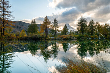 Beautiful autumn landscapes. Amazing sunset on Lake Grindjisee, Swiss Alps, Zermatt resort...