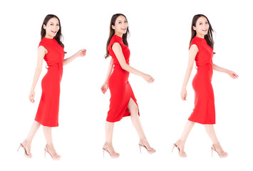 Portrait beautiful woman in a red dress walking with happy expression On a white background.