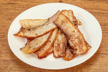 Roasted juicy bacon in the plate