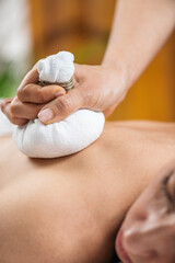 Obraz na płótnie Canvas Herbal Ball Compress Massage