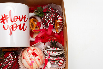 Set of sweets and glass cup. Set of assorted sweets and gift cup.