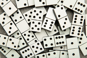 Domino pieces on the grey background. Macro photo