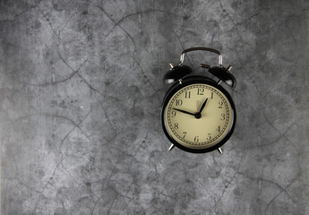 alarm clock isolated on gray background. Image contains copy space