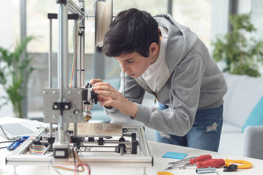 Young Student Using A 3D Printer