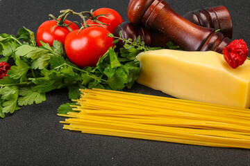Raw Italian spaghetti heap with cheese