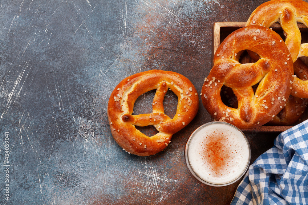 Wall mural Lager beer mug and fresh baked homemade pretzel