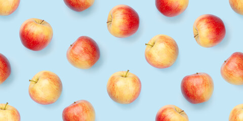 Red apple fruits over blue seamless