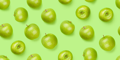 Green apple fruits over green seamless - obrazy, fototapety, plakaty