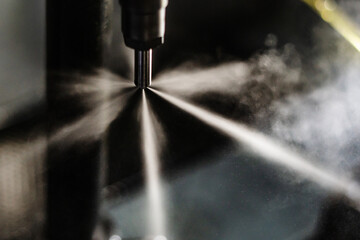 Fuel injector in action spraying fast passing the test - obrazy, fototapety, plakaty