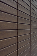 brown wooden wall with horizontal stripes.