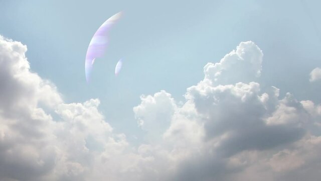 Three Crescents In Daytime Sky Clouds - Crescent moons of a gas giant with two satellites in the blue sky of an alien planet among swirling clouds.