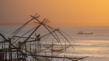 Fishermen in Songkhla Lake early in the morning.