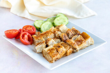 Turkish style meat stuffed filo dough borek served kol boregi.
