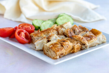 Turkish style meat stuffed filo dough borek served kol boregi.
