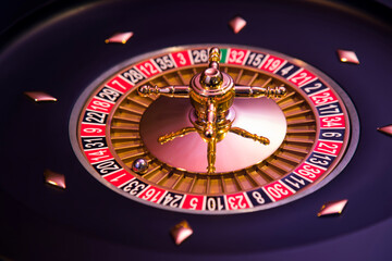Roulette wheel in motion in a casino background