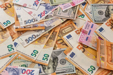 Fototapeta na wymiar background from different money euro and dollars hryvnia