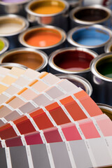 Open paint cans with a brush, Rainbow colors