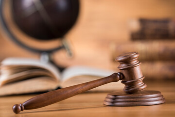 Law and justice concept, wooden gavel, globe background