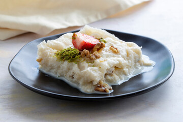 Gullac on a white background. Traditional Ramadan dessert. Milk dessert. Local name Güllaç