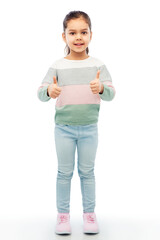 childhood, fashion and people concept - happy smiling girl showing thumbs up over white background