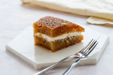 Creamy bread dessert on a white background. Local name kaymaklı ekmek kadayıfı